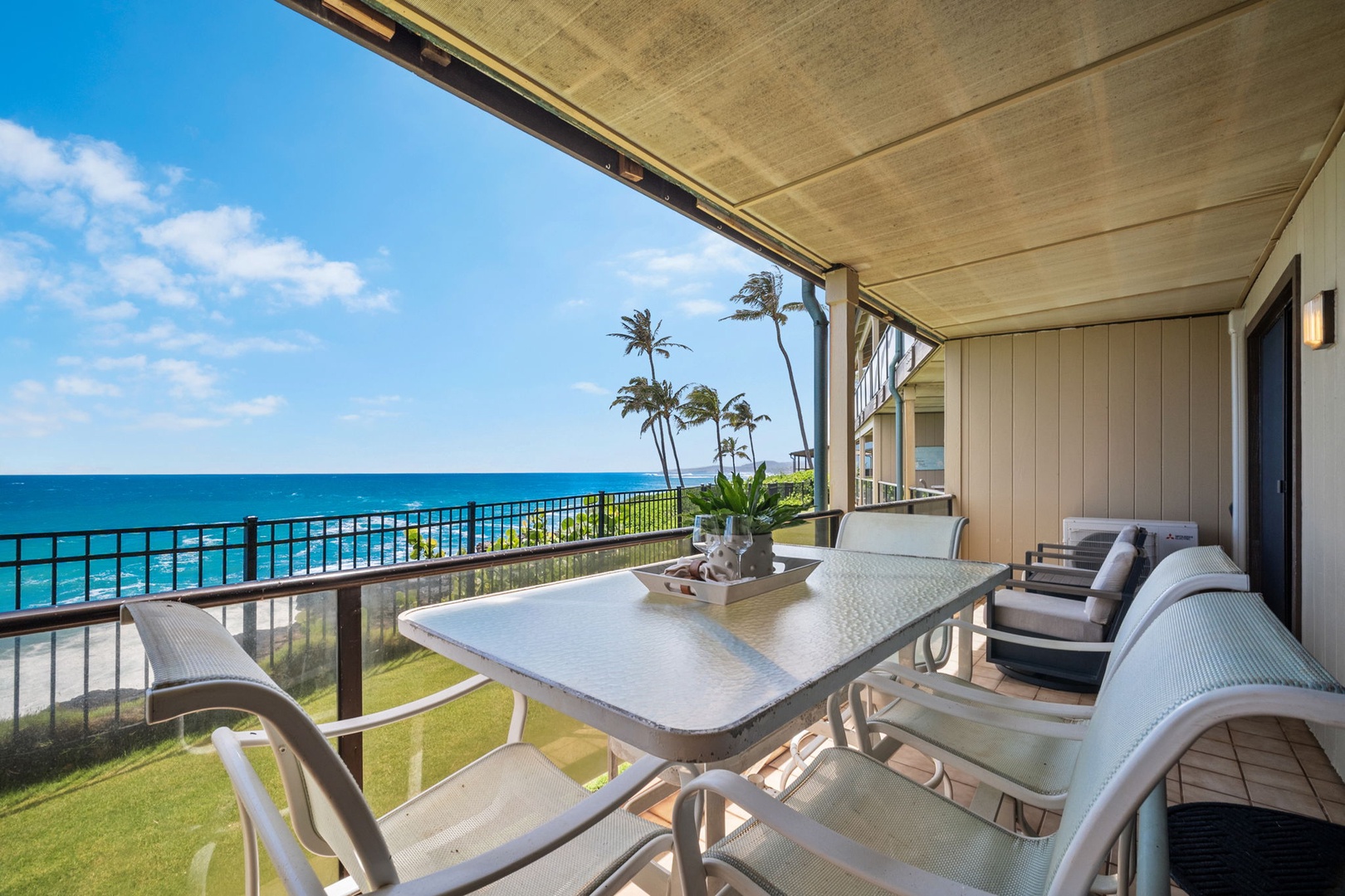 Picture yourself savoring morning coffee at your private oceanfront table, feeling the tropical breeze as azure waves sparkle below and palm trees sway against endless blue skies.