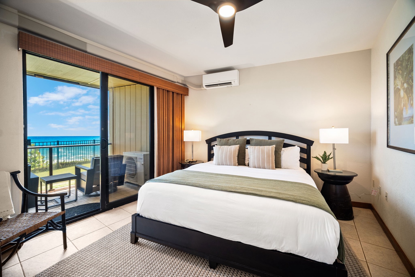 Drift off to sleep in your serene bedroom, where the plush bed and gentle ocean breezes from your private balcony create the perfect retreat after a day of coastal adventures.