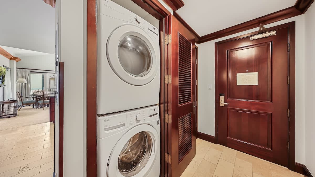 You'll find convenient in-unit laundry with a stacked washer and dryer tucked neatly into a closet, making it easy to freshen up after beach days or adventures.