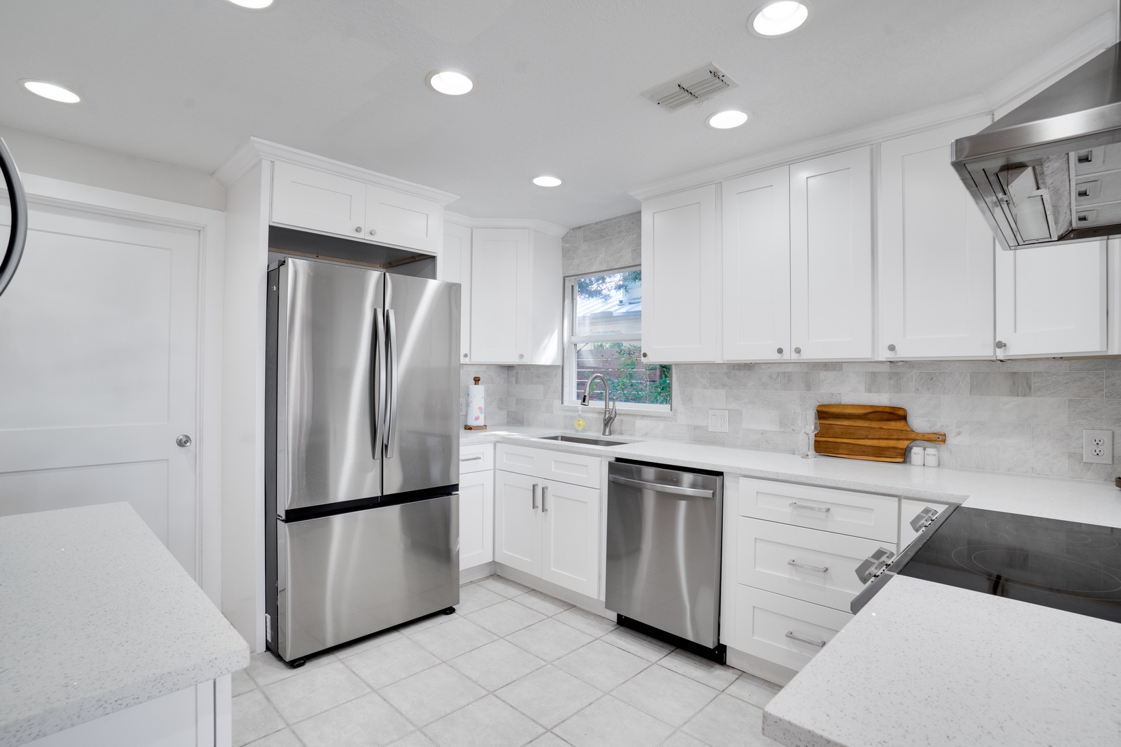 Your culinary dreams come alive in this pristine kitchen with marble counters, stainless appliances, and abundant storage for memorable meals.