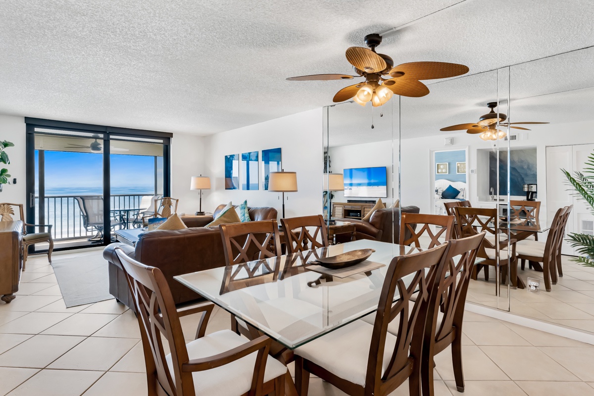 Gather around the spacious dining table while tropical breezes drift through from your private balcony. Floor-to-ceiling windows frame endless ocean views, inviting you to linger over meals with the sound of waves as your soundtrack.