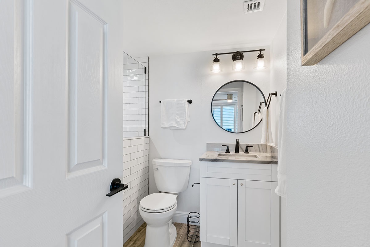 Step into your bright, modern bathroom with classic subway tile shower, stylish vanity, and thoughtful touches that make getting ready a pleasure.