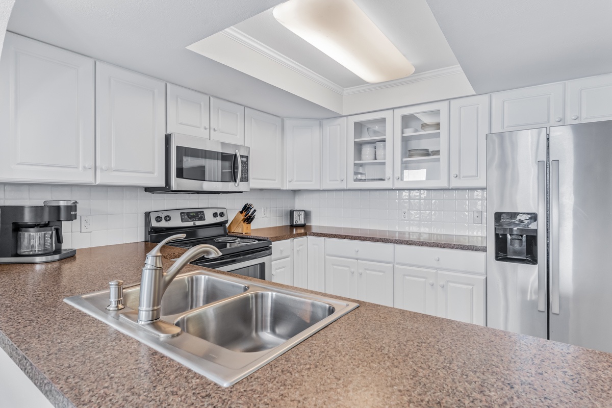 Your fully equipped kitchen awaits with granite counters, stainless appliances, and everything you need to create memorable meals during your stay.