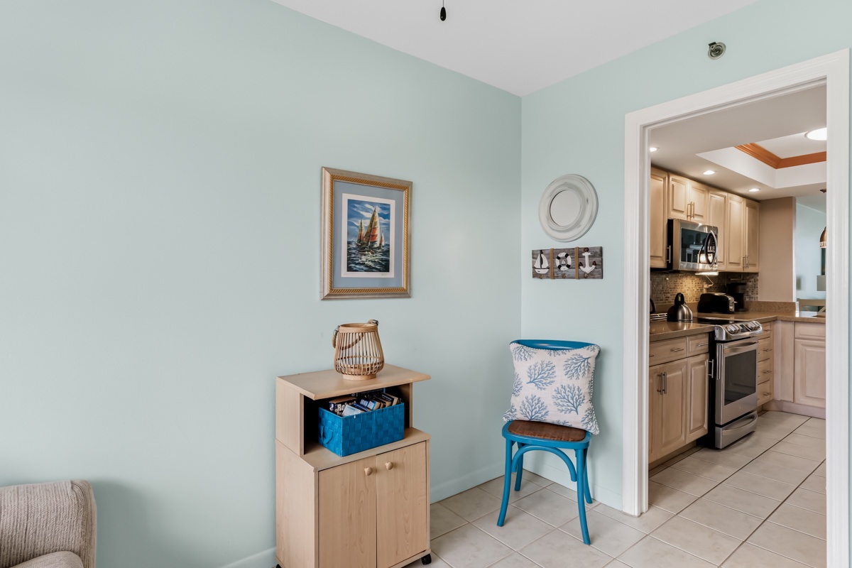 Bright, coastal-inspired interiors welcome you with soft blue hues and beach-themed accents. Your fully equipped kitchen awaits just steps away, ready for home-cooked meals.