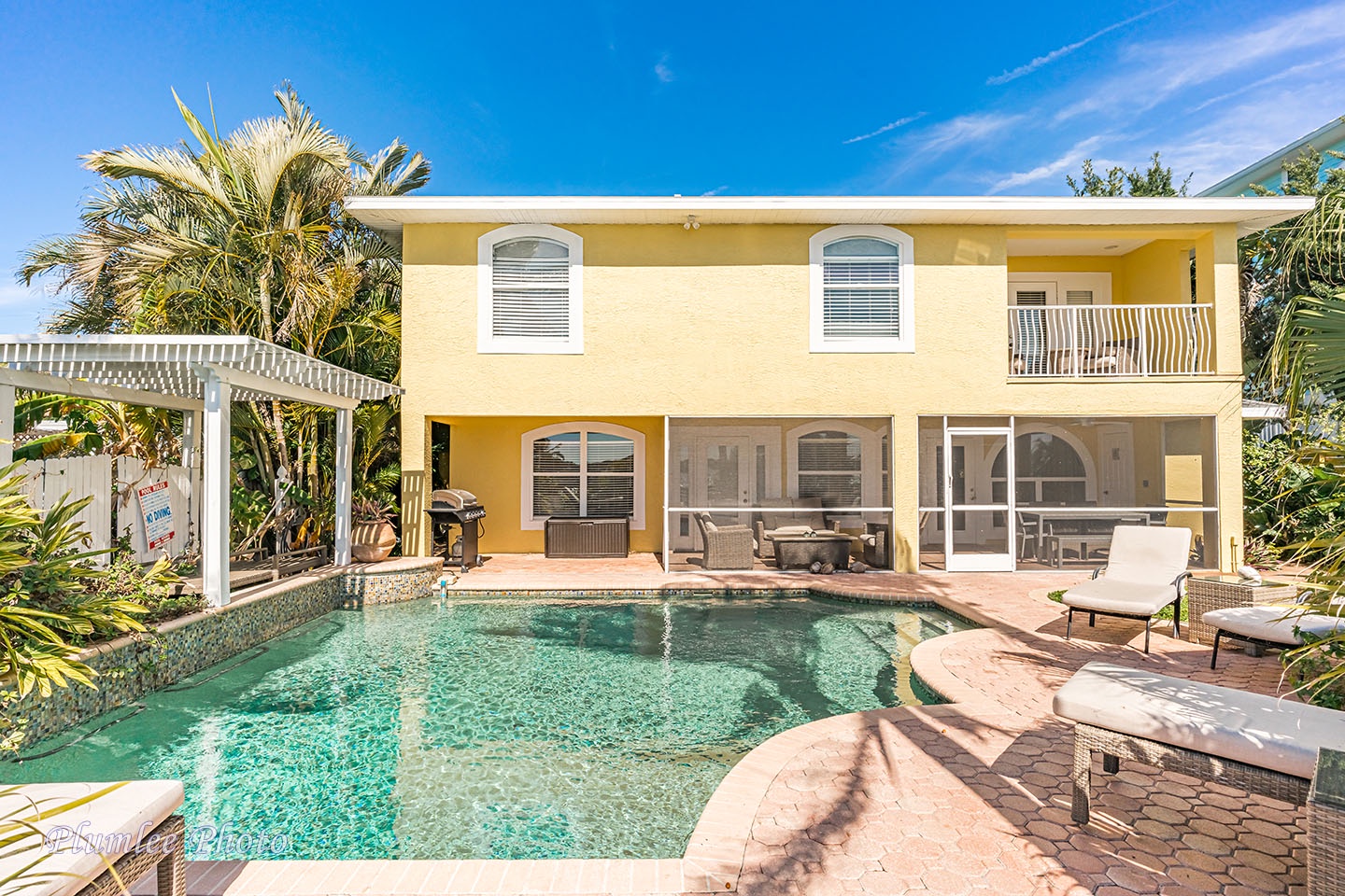 There's a screened in lanai on the first floor, and a balcony on the second floor.