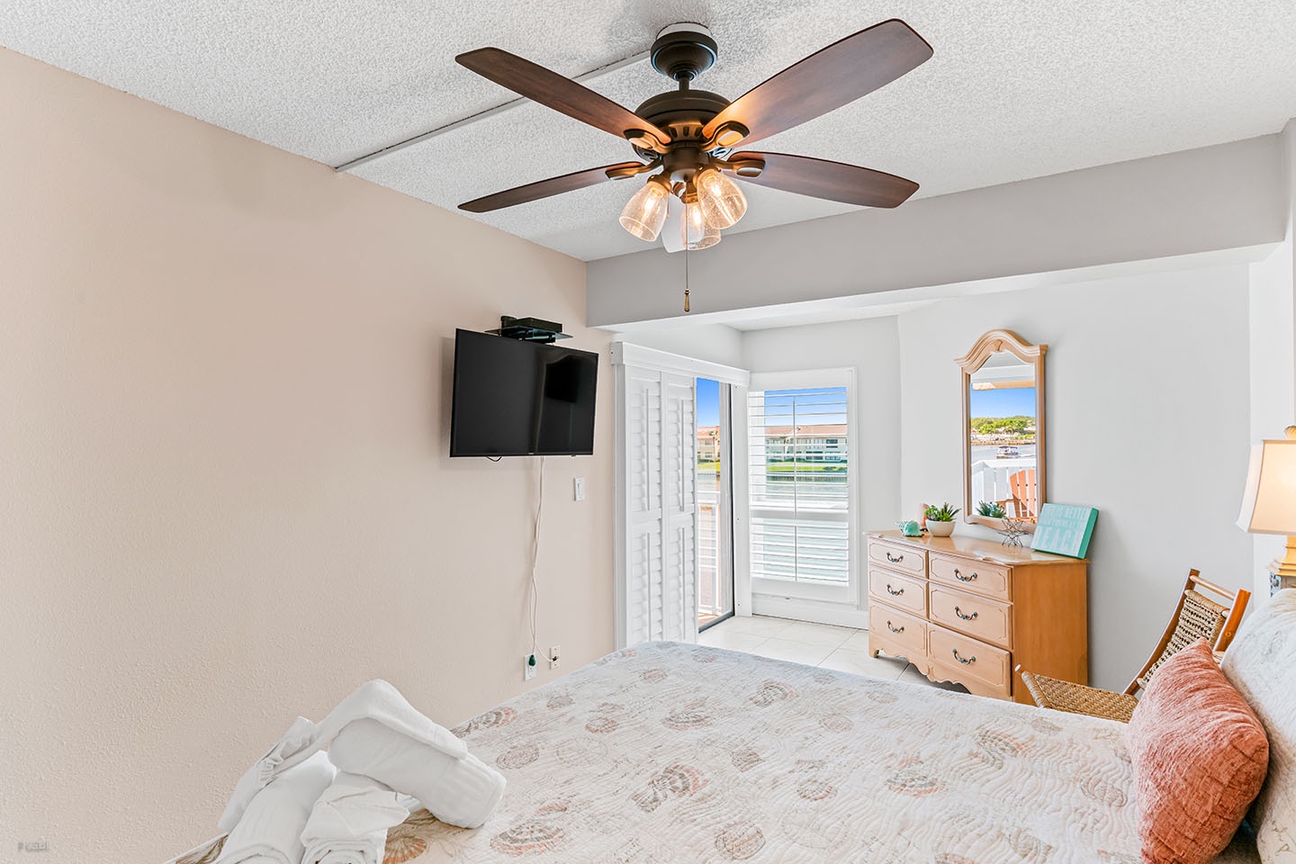 The Master Bedroom has a water view and balcony access.