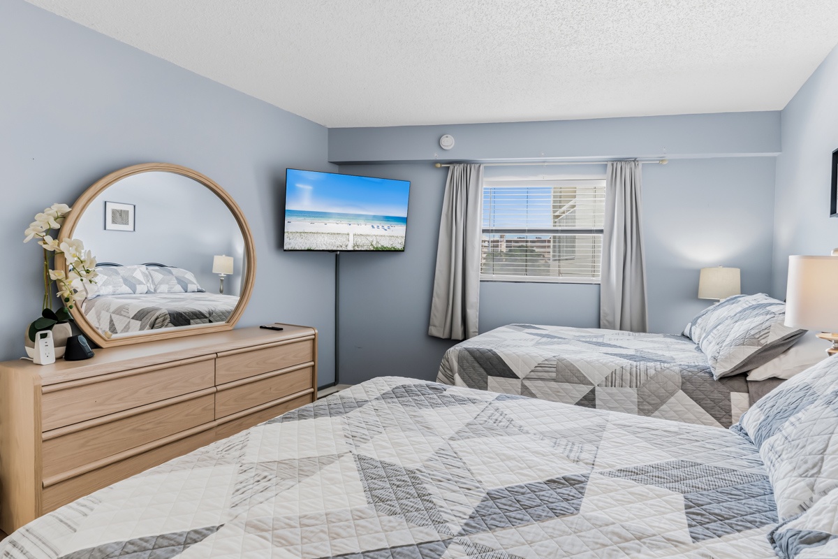 Your peaceful retreat with soft coastal hues, 2 comfy Double beds, and a window welcoming natural light—perfect for unwinding after a day of adventure.
