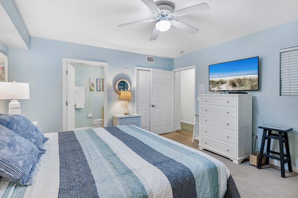 Unwind in your tranquil coastal bedroom with soothing blue tones, comfortable bedding, and all the amenities you need for a perfect beach getaway.