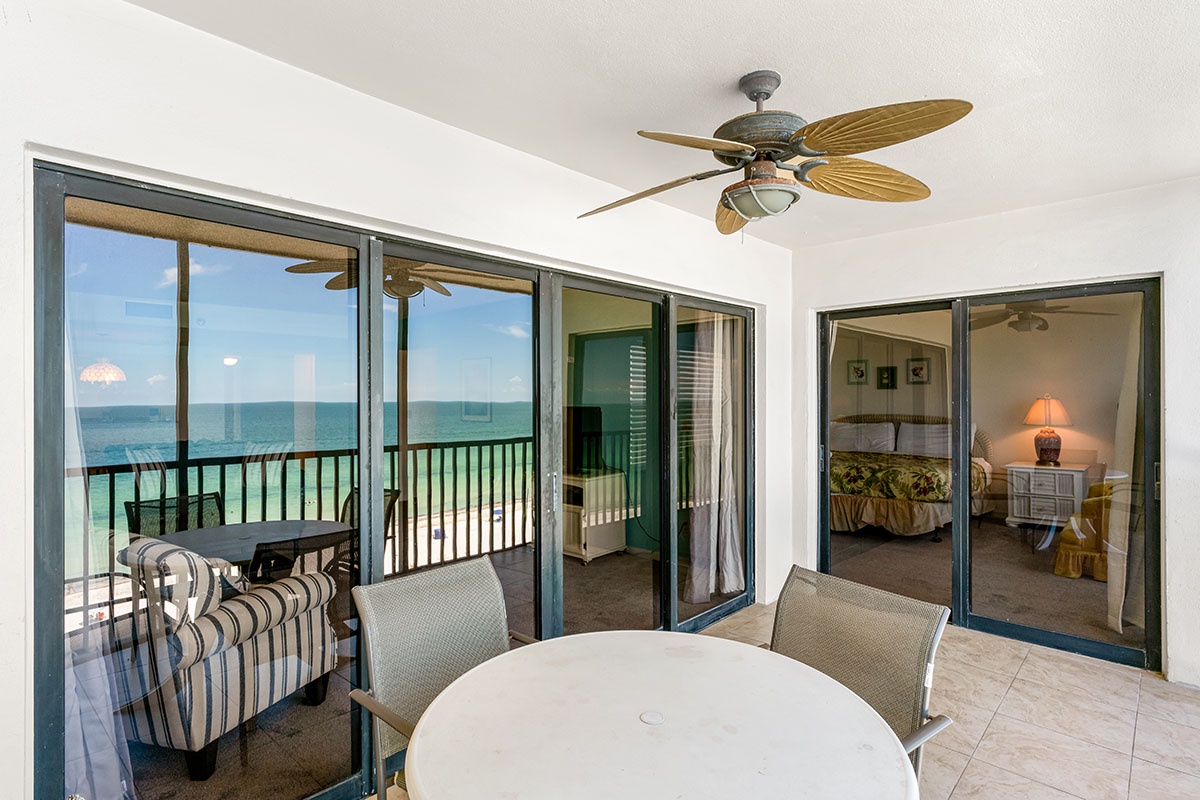 Unwind in your bright living space with stunning ocean views and tropical ceiling fan keeping you cool.