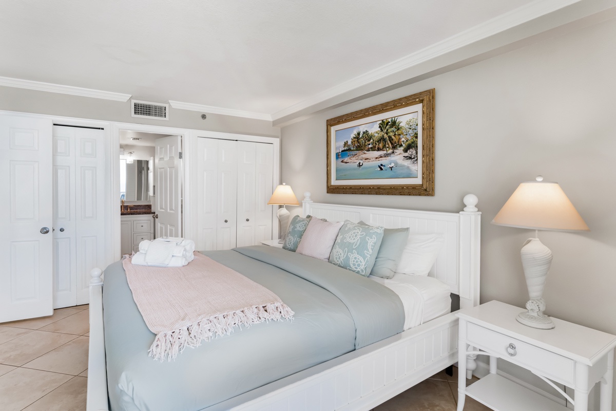 Drift off to coastal dreams in your serene bedroom, featuring soft linens and beach-inspired artwork that creates a peaceful seaside sanctuary.