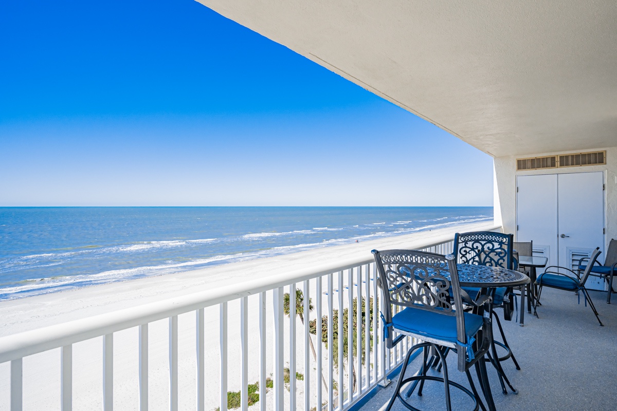 Savor morning coffee at your private oceanfront table while endless waves kiss pristine white sand just steps below your covered terrace.