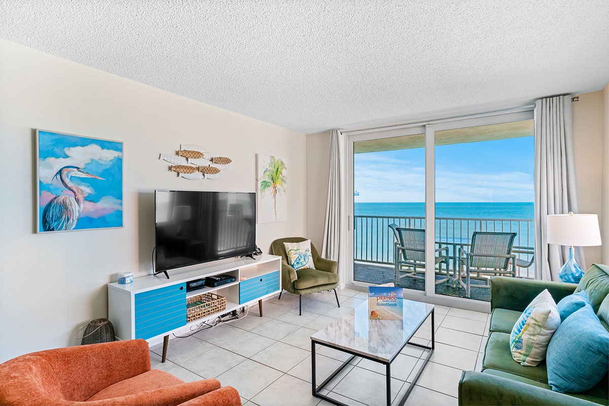 Relax in your coastal living room with ocean views and modern comforts for the perfect beach getaway.