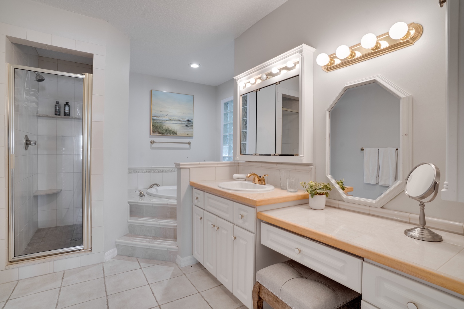 Luxurious ensuite with spa-like soaking tub, separate glass shower, and dual vanities where you can pamper yourself in complete comfort.
