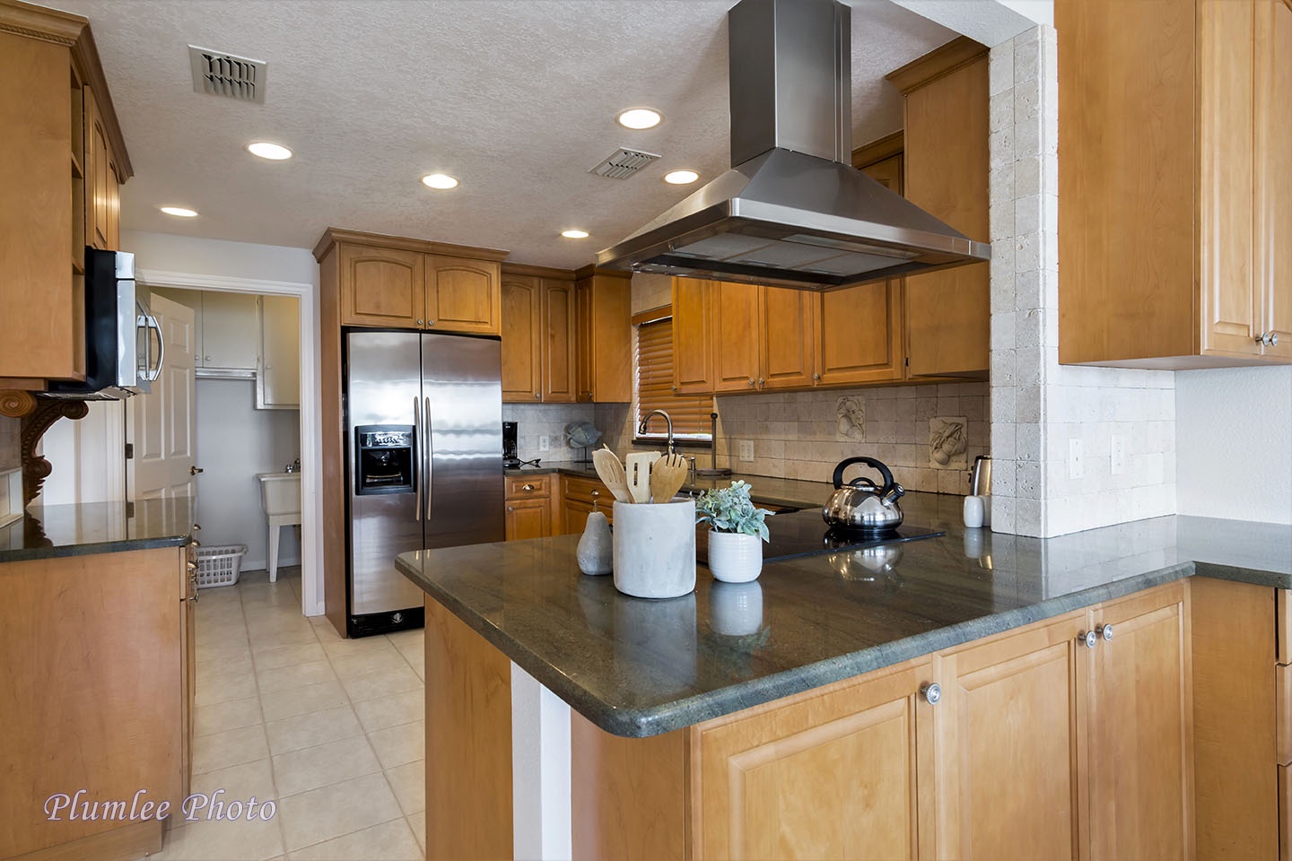 There's plenty of counter space.  The laundry room is in the background.