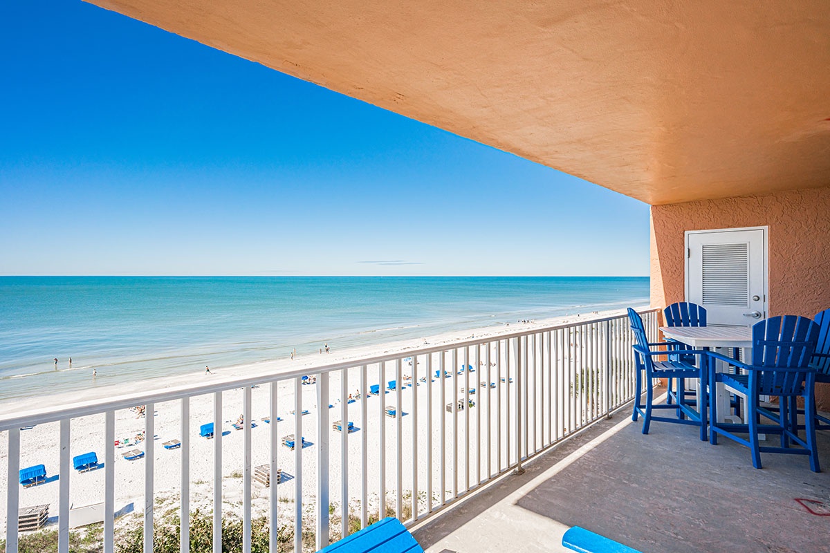 Relax on your private balcony with stunning ocean views and watch beachgoers enjoy the pristine white sand below.
