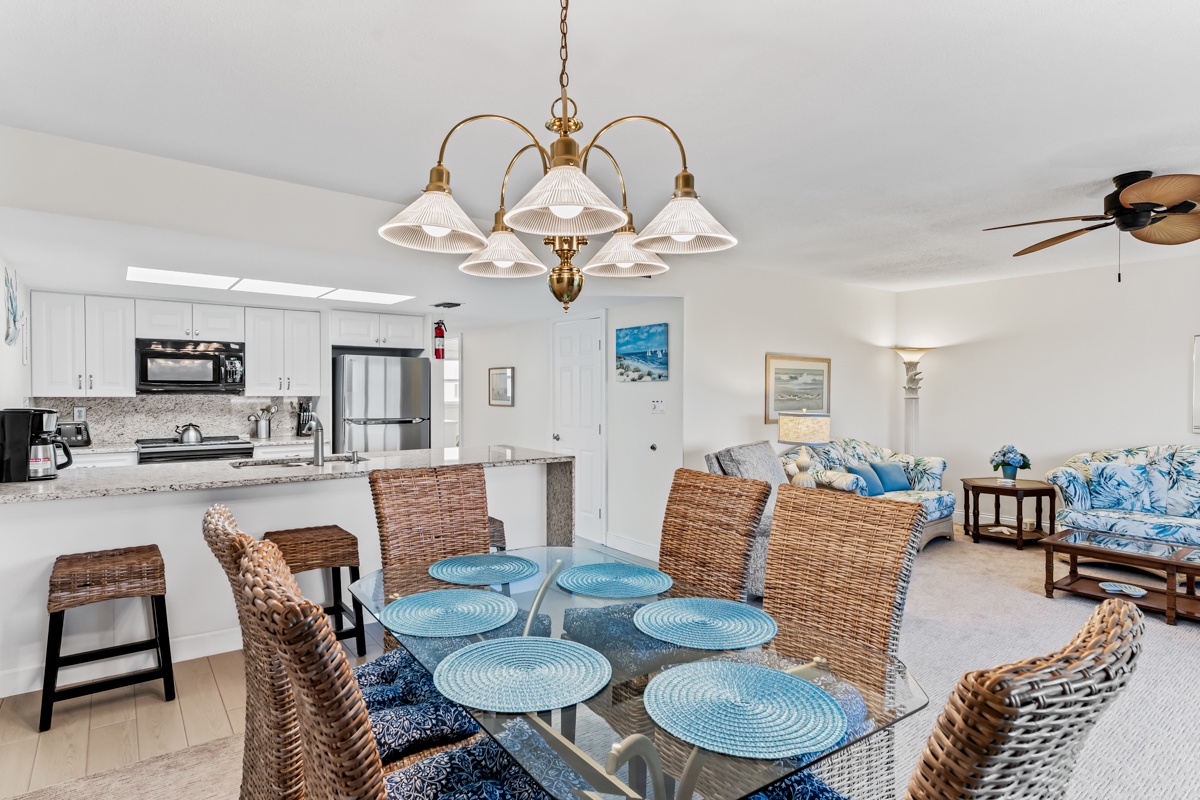 You'll love the open-concept design where coastal charm meets modern convenience, from the fully equipped kitchen to the comfortable dining space.