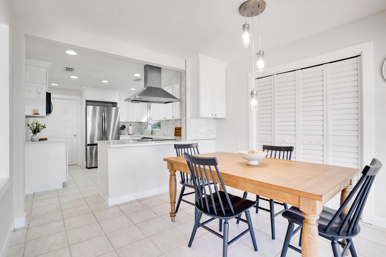Gather around your stylish dining table for meals while the chef prepares favorites in your bright, modern kitchen.