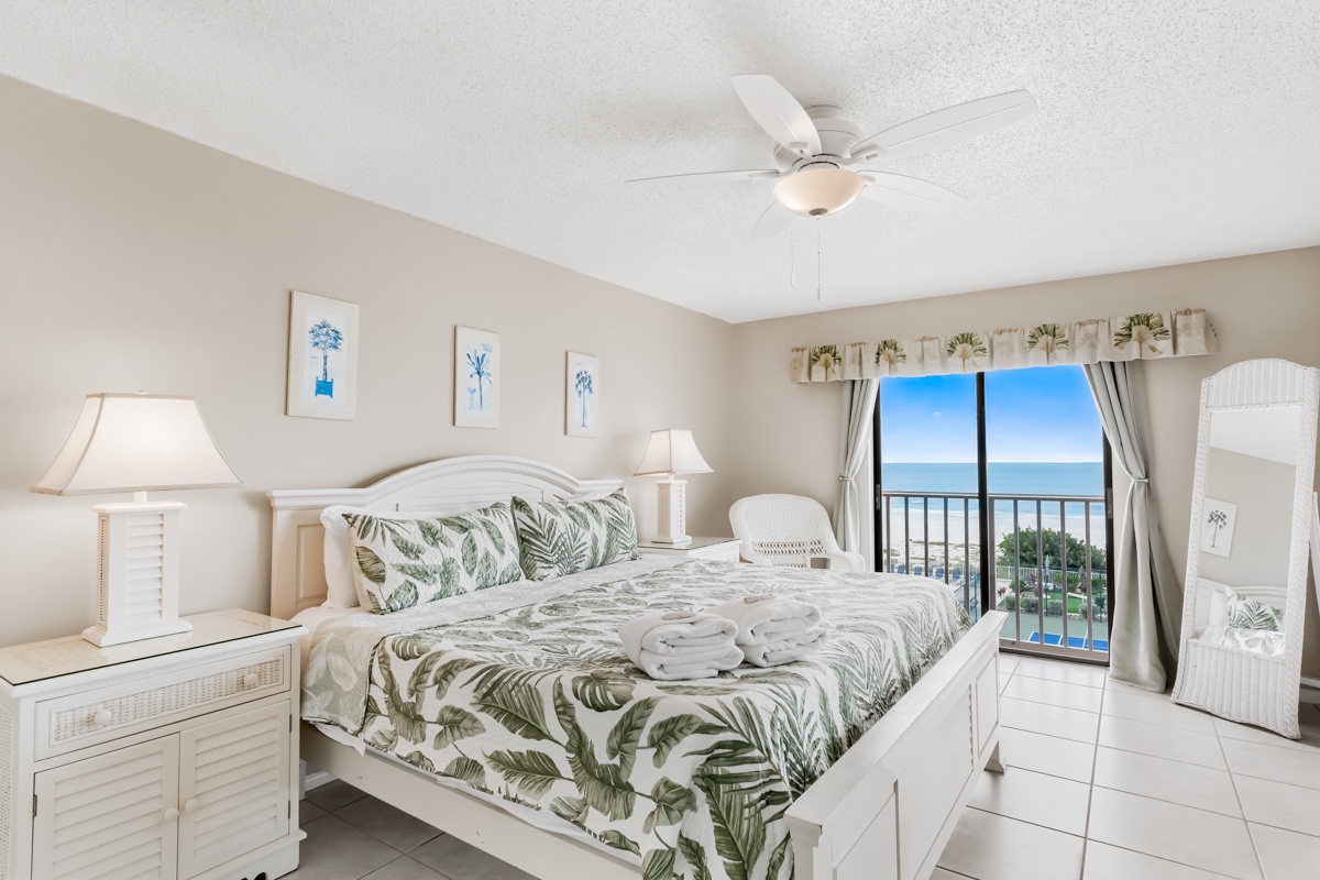 Wake up to ocean breezes in your coastal bedroom, where tropical prints and soft lighting create the perfect beachside retreat.
