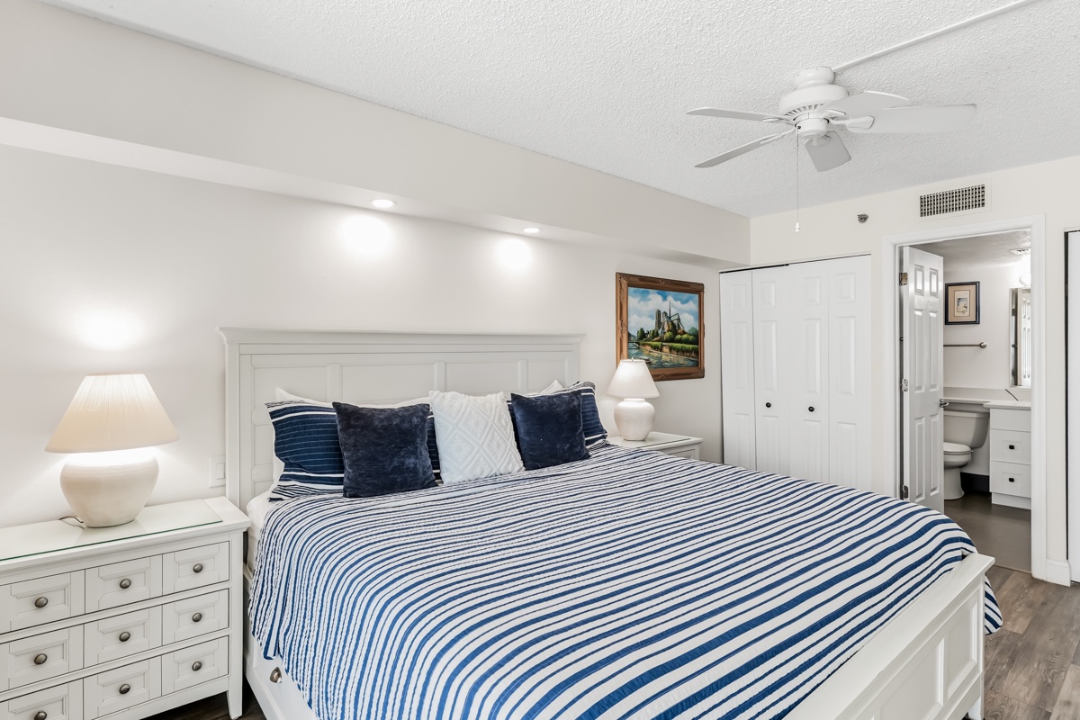 Drift off in crisp white comfort with fresh linens, soft lighting, and a coastal-inspired palette that invites restful nights and easy mornings.