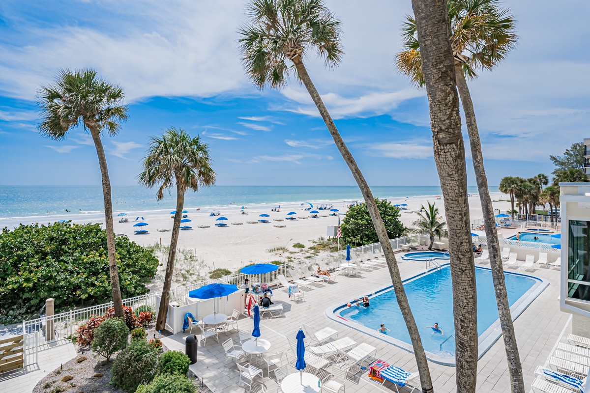 The property's beachfront location offers direct access to white sand shores, swaying palms, and sparkling waters—just steps from your door.