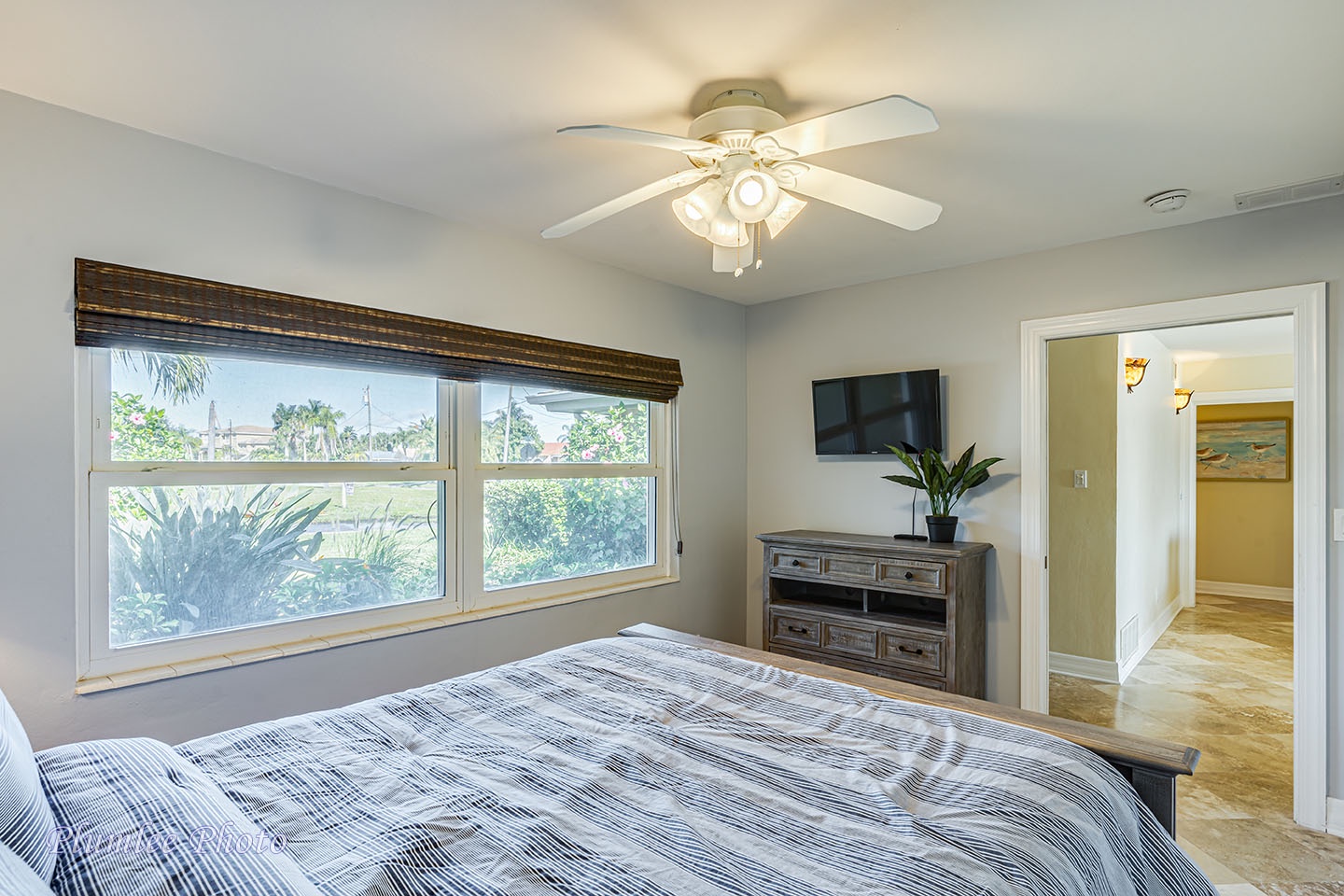 4th bedroom has ceiling fan and smart TV