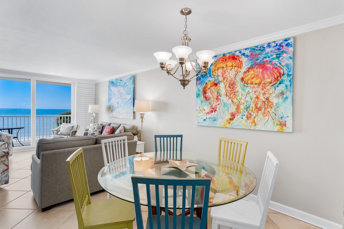 Gather around your vibrant dining table while stunning ocean views frame every meal through floor-to-ceiling windows.