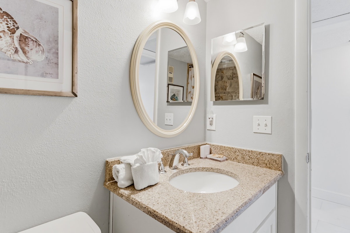 Step into your elegantly appointed bathroom with granite countertops, quality fixtures, and thoughtful amenities for a refreshing start to your day.