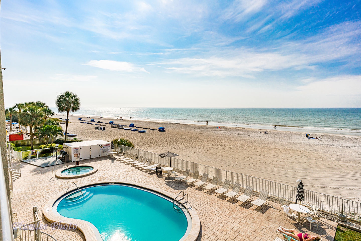 View of beach and pool deck from private balcony