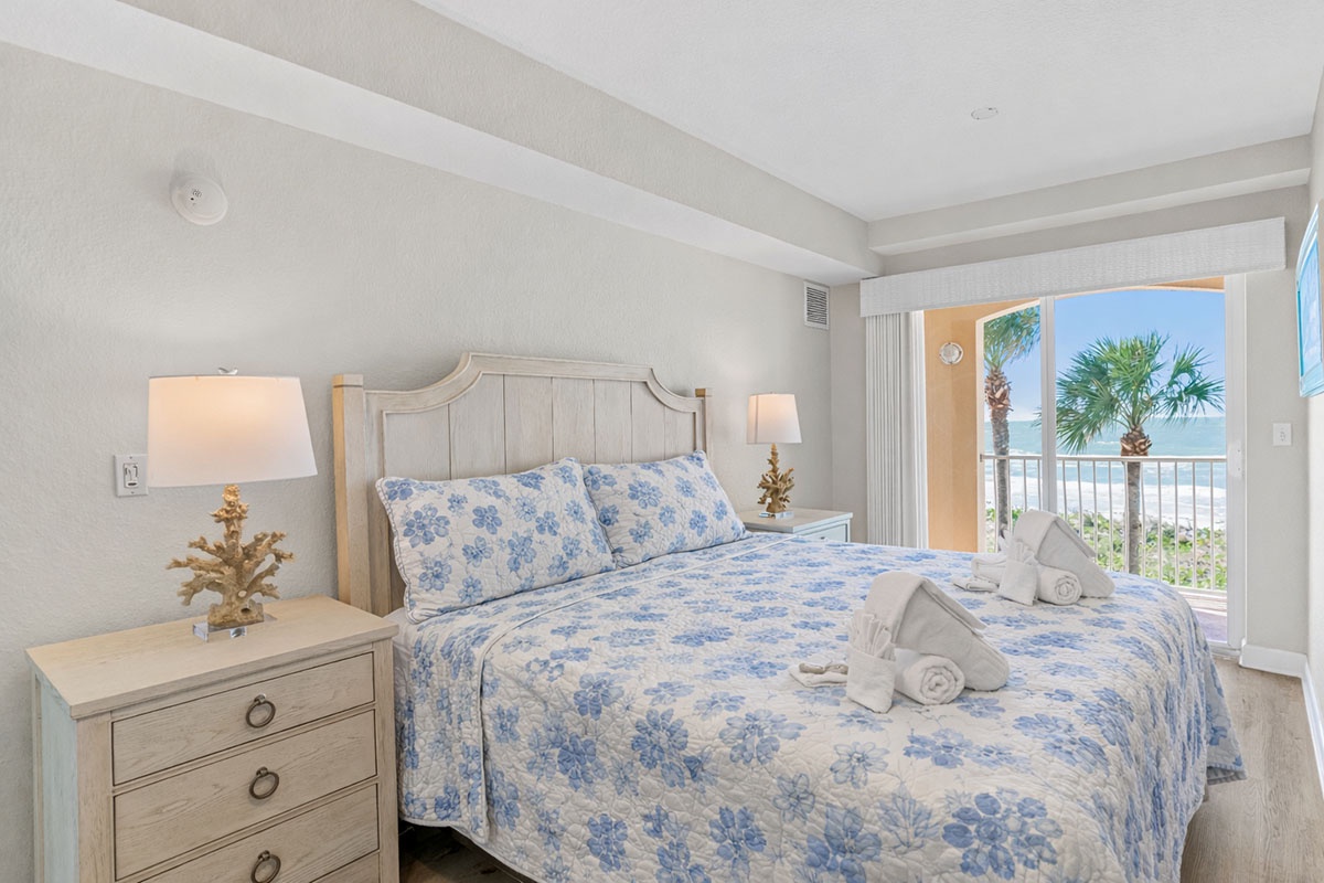 Wake up to ocean breezes through your private balcony doors, where fresh towels await and palm trees sway just beyond your bed.