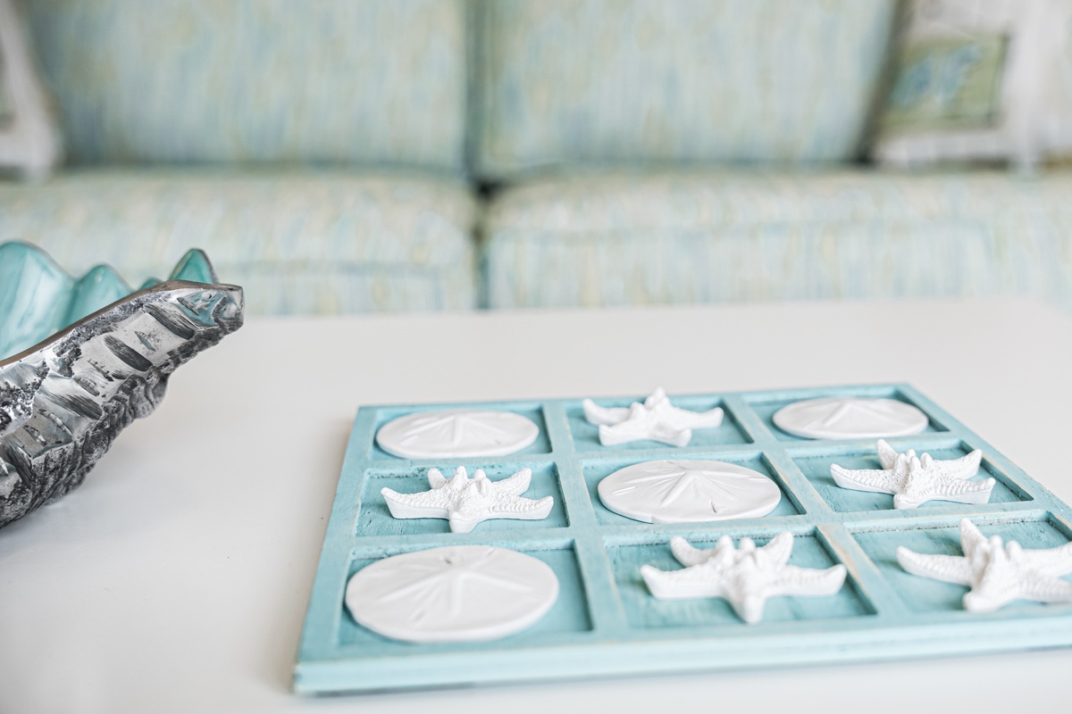 Lou's Starfish Haven features charming coastal touches with starfish and sand dollar accents that bring seaside serenity to your daily routine.