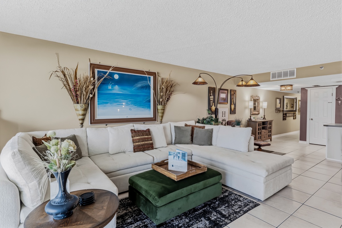 Sink into this spacious sectional and let your worries melt away. The coastal artwork and soft lighting create your perfect retreat after sun-soaked beach days.
