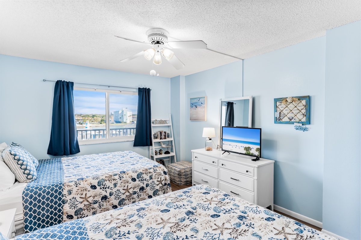 Sink into your cozy retreat with two plush beds and a breezy coastal theme that invites you to unwind in style.
