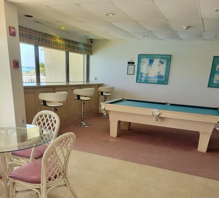 Community room has pool table and area to hang out in AC