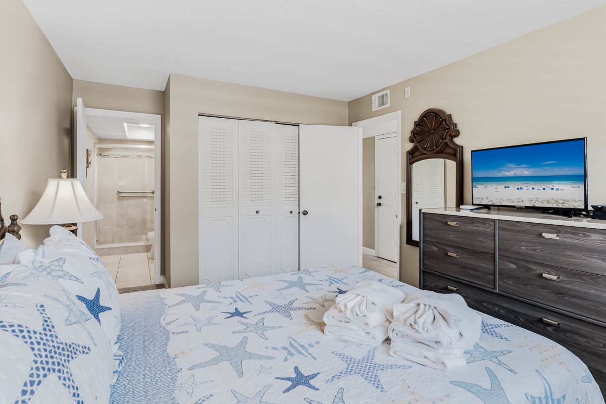 Unwind in your serene coastal retreat, where fresh linens and beach-inspired décor set the scene for restful nights. Your private ensuite bathroom awaits just steps away.