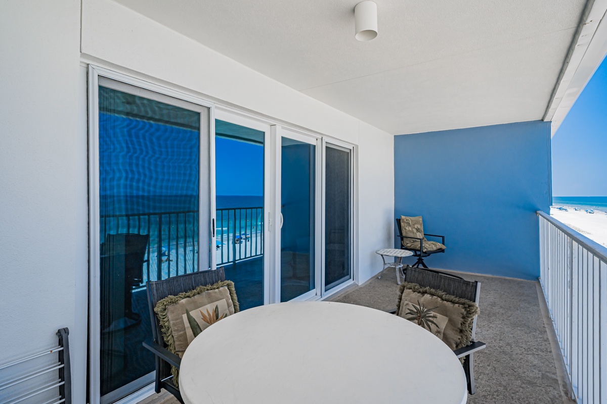 Step out onto your private balcony where morning coffee meets endless ocean views. A cozy table awaits for peaceful breakfasts or sunset dinners, while soft breezes and beach sounds make every moment feel like paradise.