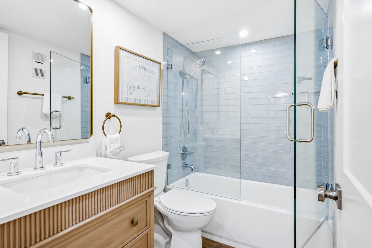 Unwind in your spa-like bathroom featuring elegant marble counters, a relaxing soaking tub, and premium fixtures for ultimate comfort.