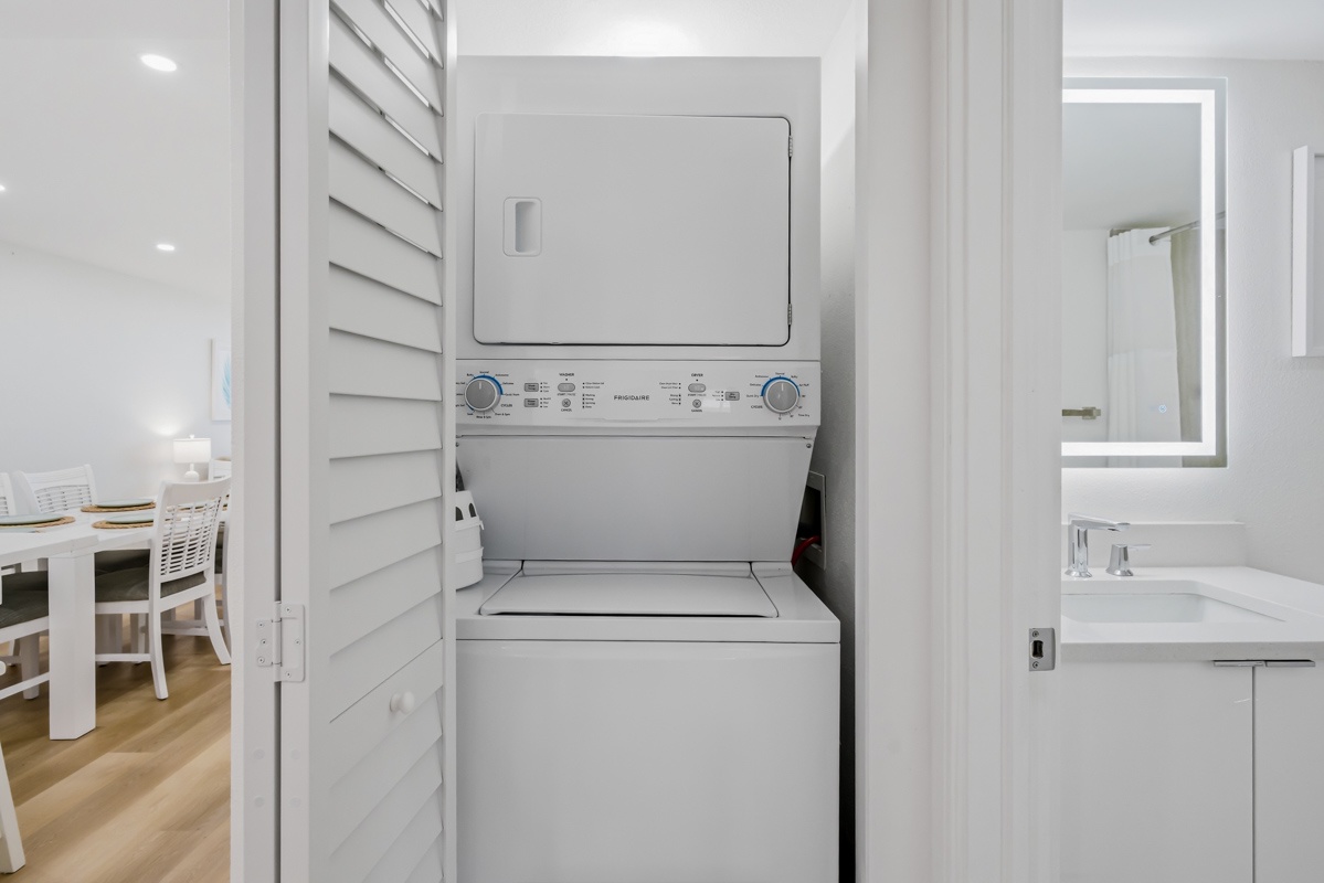 Your in-unit washer and dryer make packing light effortless, tucked neatly behind louvered doors for convenience.