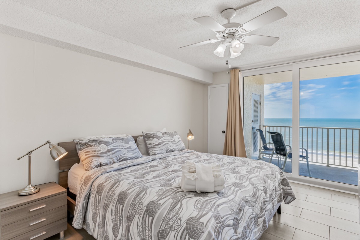 Wake up to endless ocean views from your private balcony. This serene bedroom offers coastal comfort with gentle sea breezes flowing through.