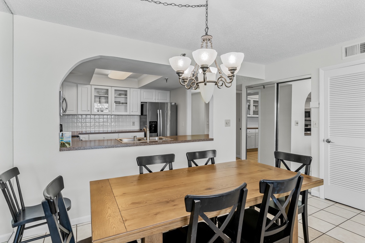 Gather around your beautiful dining table, perfectly positioned beside the open kitchen for effortless entertaining and memorable meals together.