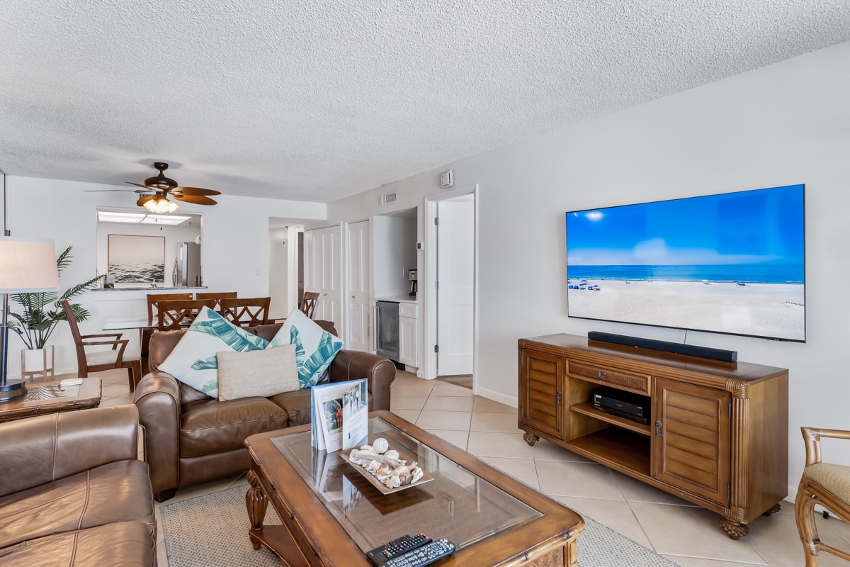 Step into your inviting living space, where plush leather sofas and coastal accents create the perfect spot to unwind after a day of adventure.