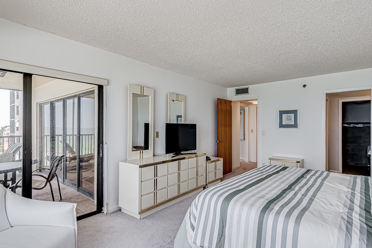 Primary bedroom with access to balcony