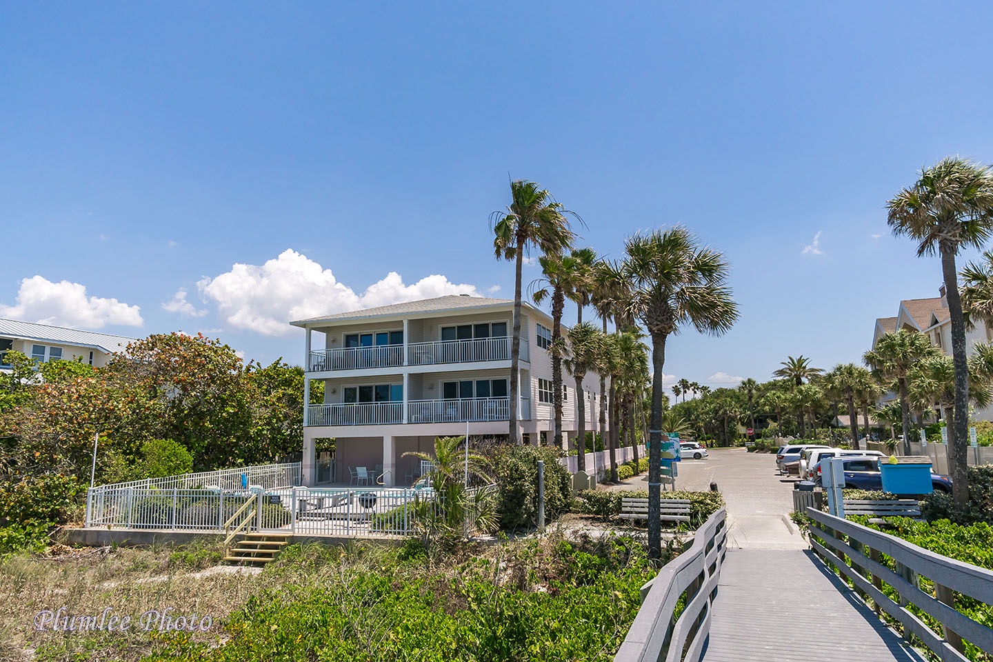 Steps go from the pool deck down to the beach.