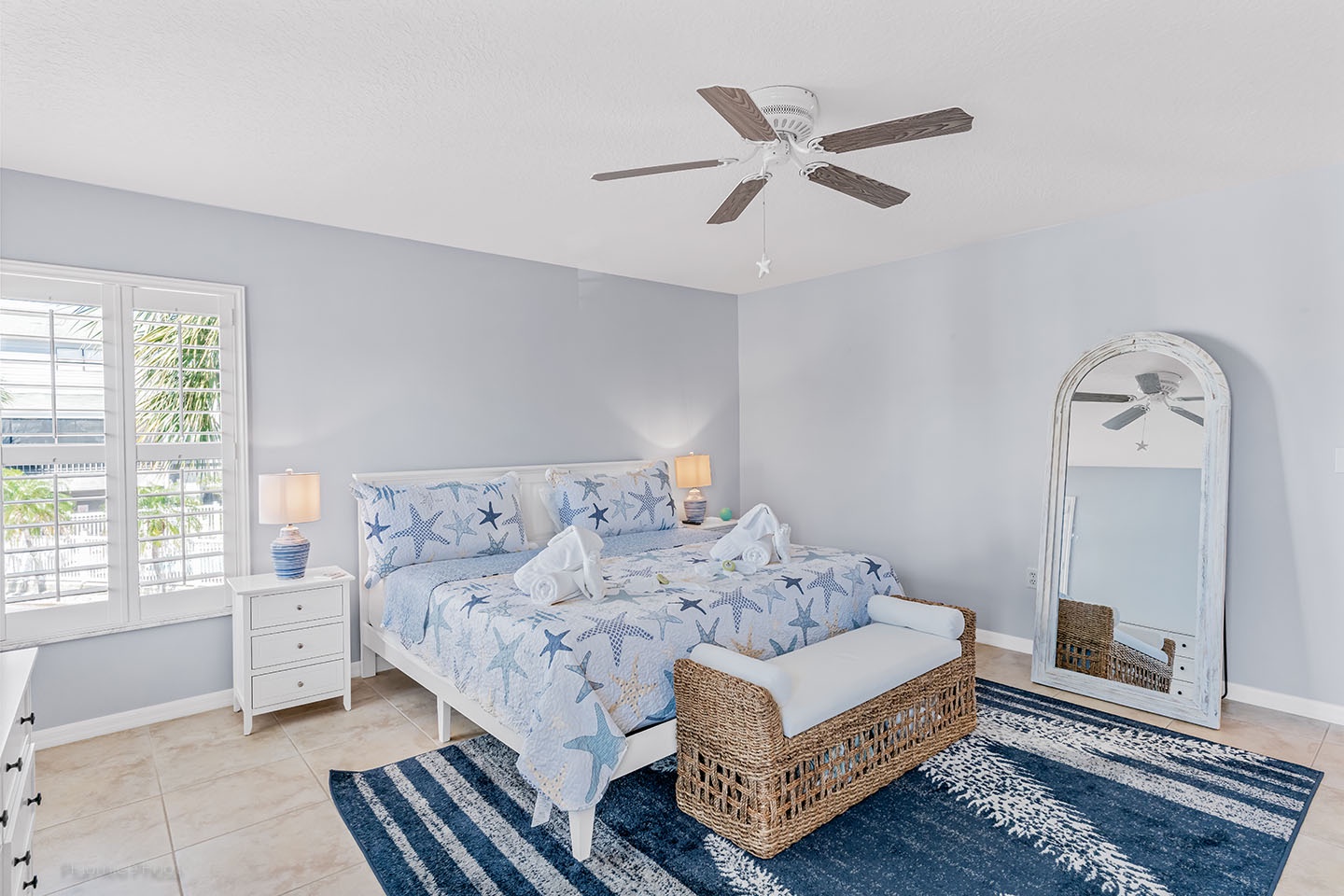 Primary bedroom with King bed and ceiling fan