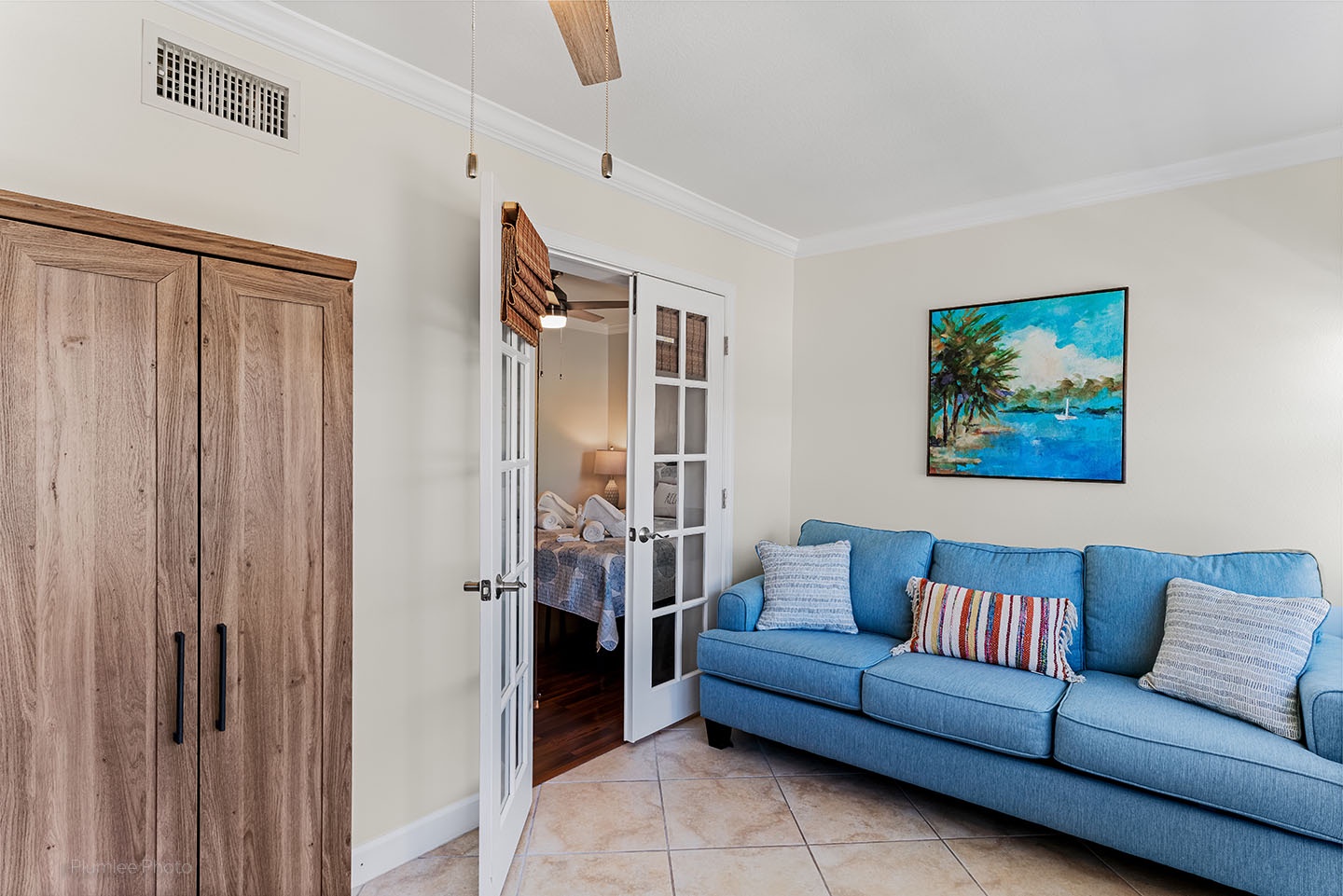 Den has opening to living room and bedroom