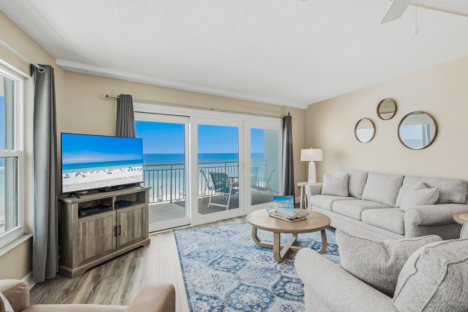 Sink into plush sofas and let the sweeping beach and ocean views through your private balcony door set the tone for pure relaxation.