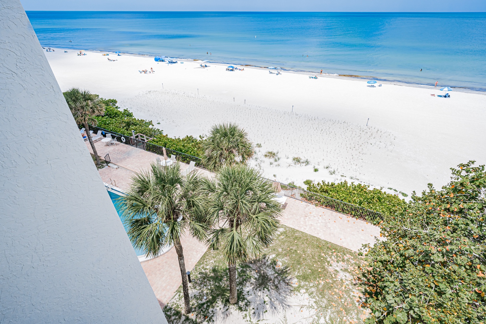 Stunning beachfront property overlooking pristine white sand and turquoise Gulf waters, with direct beach access and a relaxing coastal setting just steps from the shore.