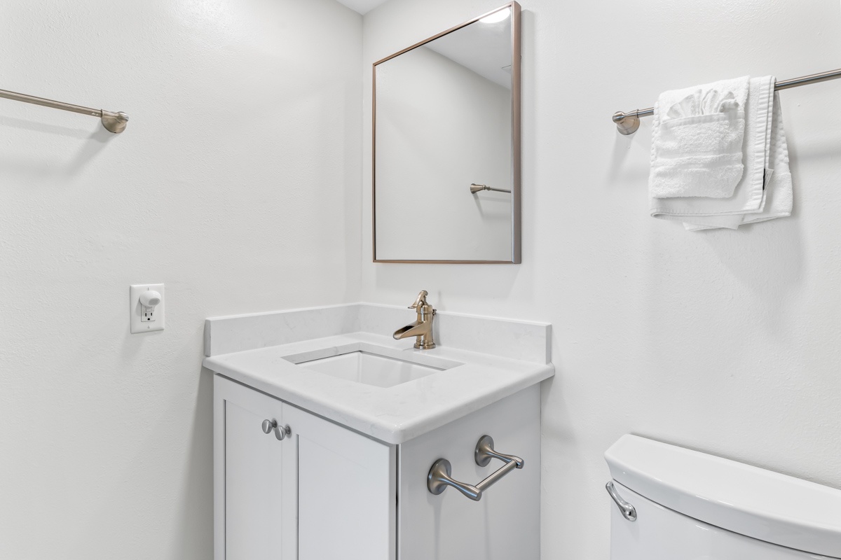You'll appreciate the pristine bathroom with elegant marble countertops, fresh towels, and thoughtful details throughout.