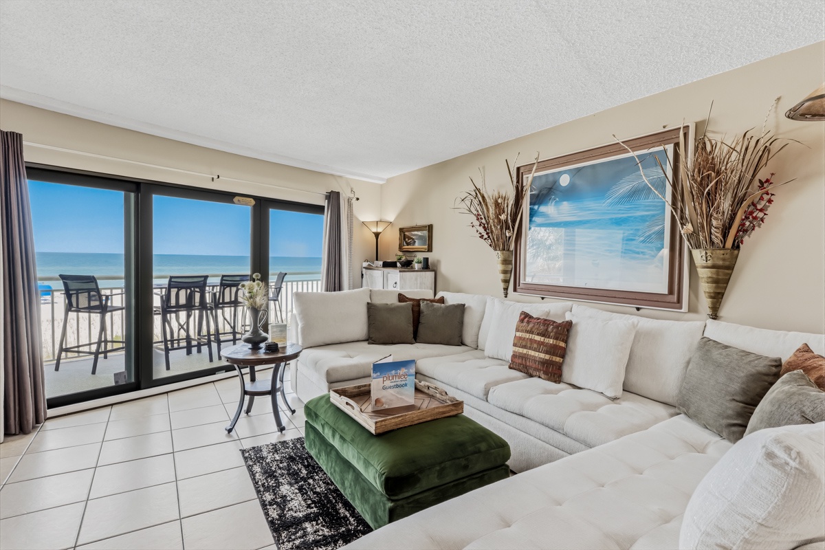 Sink into plush seating and soak up breathtaking ocean views through floor-to-ceiling glass doors that open to your private balcony with beach access.