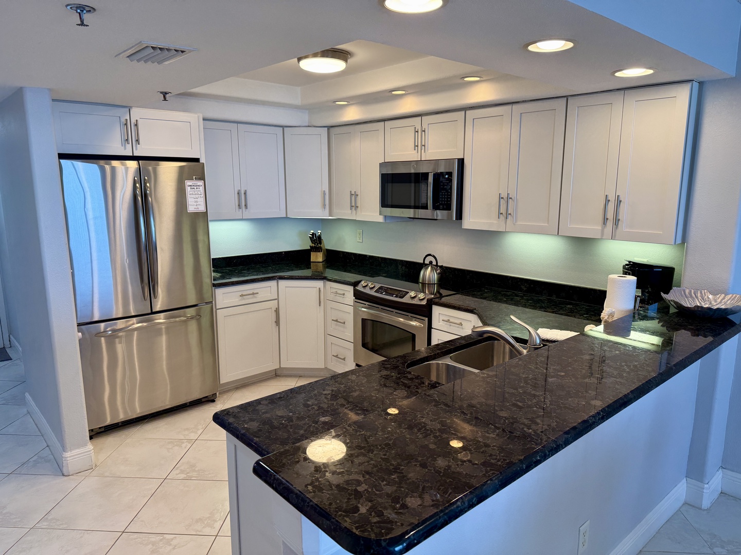 Your fully equipped kitchen features granite counters, stainless appliances, and everything needed for cooking memorable meals during your stay.