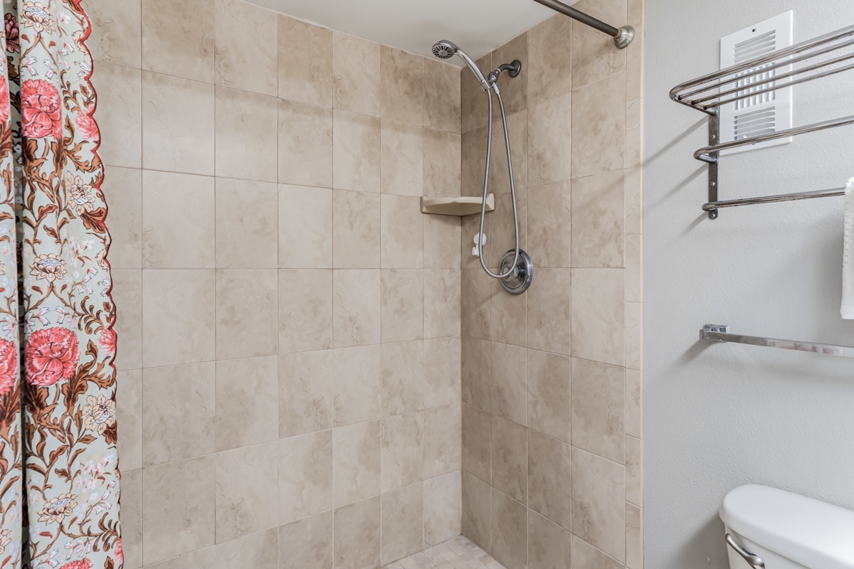 Primary ensuite bathroom with step-in shower